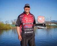 ken Mah holding his Major League Fishing trophy after his win at Clearlake in California.